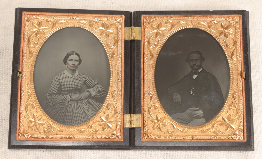 Lot 067 - Pair Of Antique 1/4th Plate Ambrotype Photographs, Married Couple, In Double Thermoplastic Union Case By S. Peck & Co. With Scroll And Medallion Design
