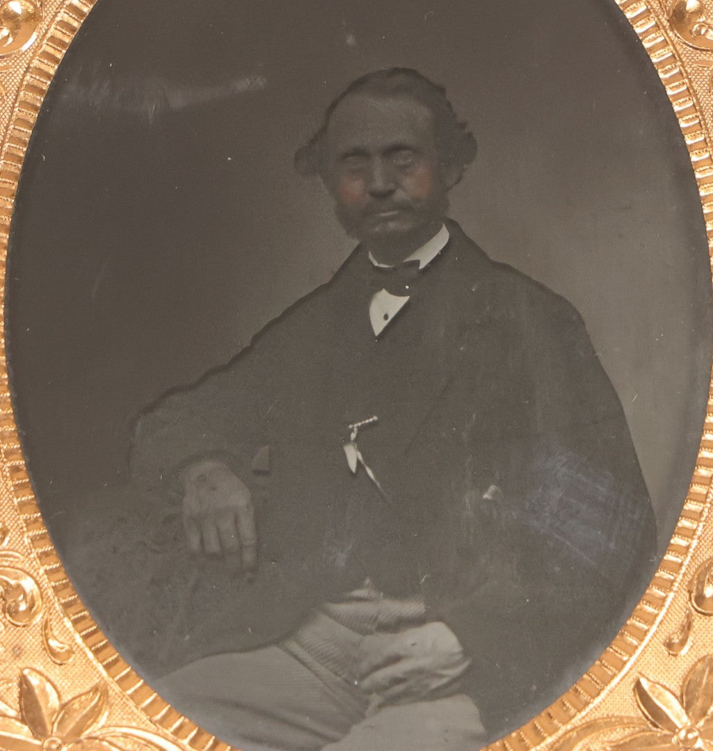 Lot 067 - Pair Of Antique 1/4th Plate Ambrotype Photographs, Married Couple, In Double Thermoplastic Union Case By S. Peck & Co. With Scroll And Medallion Design
