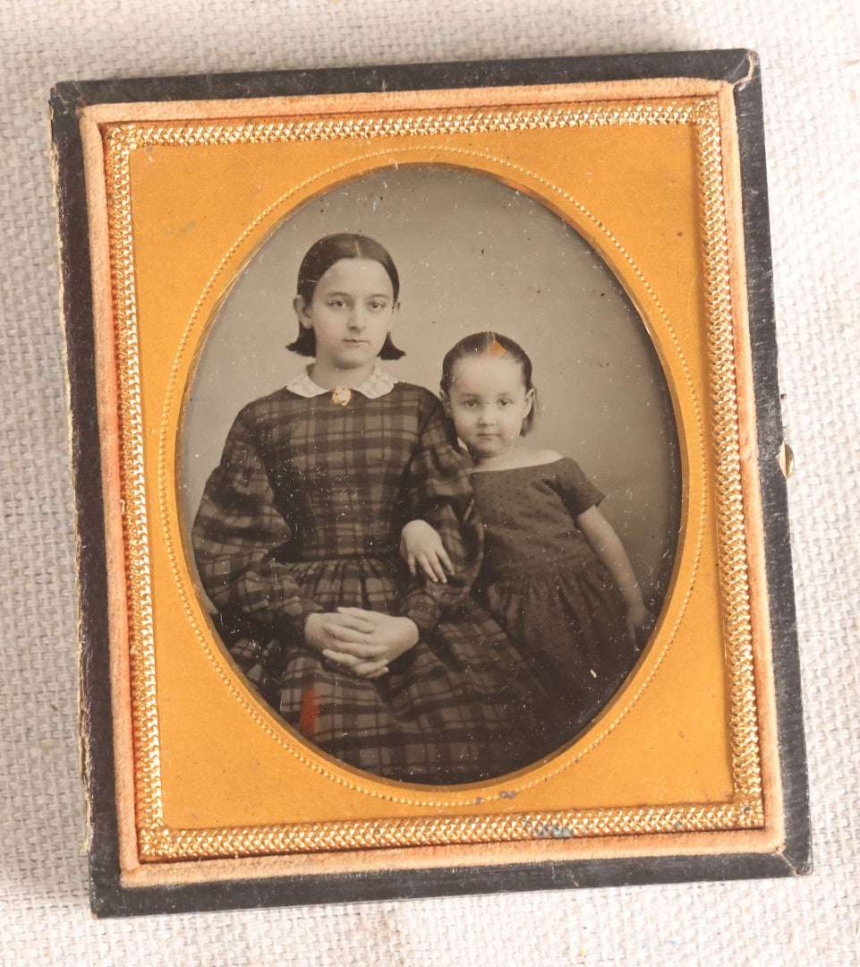 Lot 072 - Antique 1/6th Plate Ambrotype Photograph, Identified Sisters Juliet B. Cook And Anna Fassett Cook Goodman In Plaid Dresses, In Full Split Leatherette Case