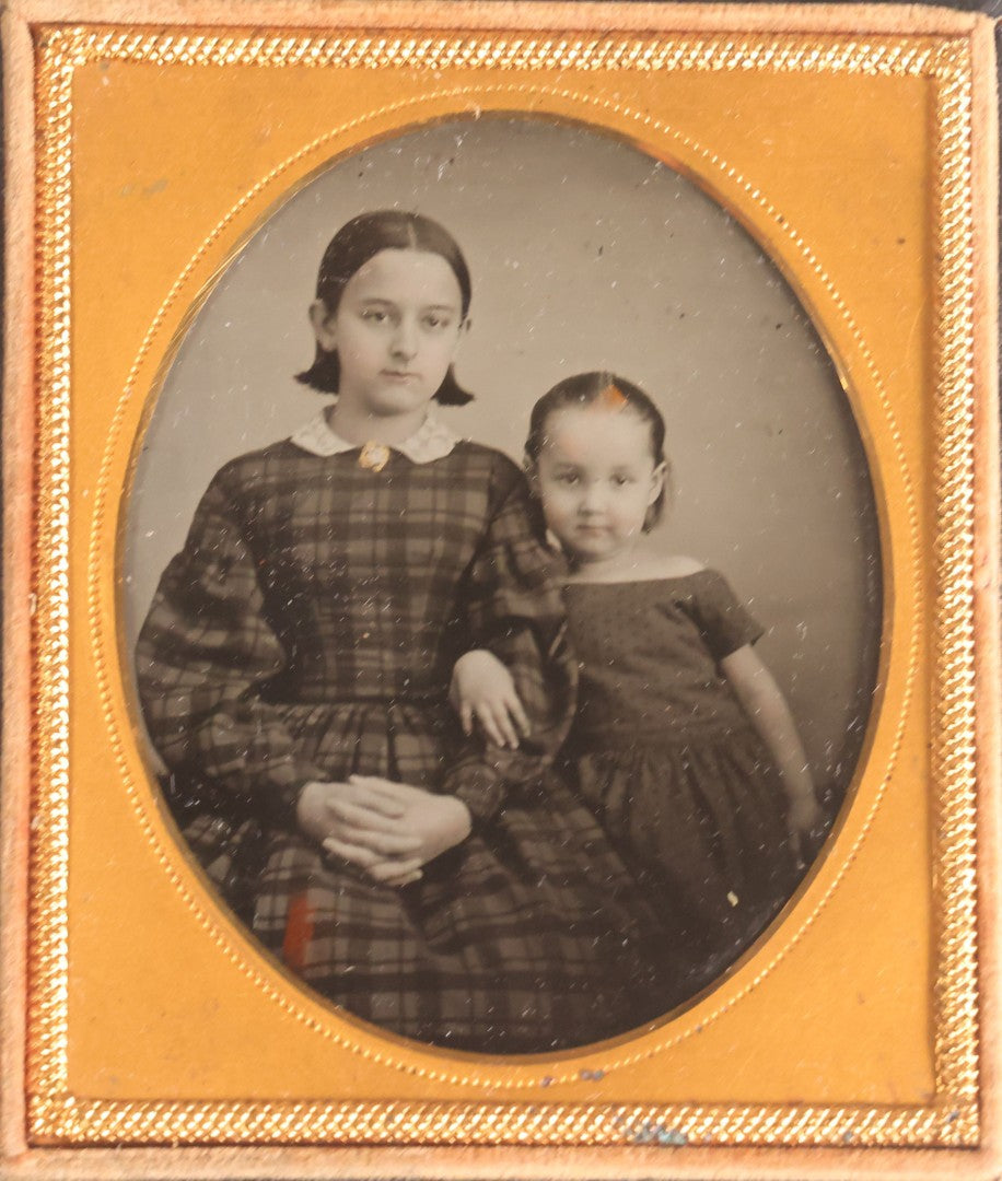 Lot 072 - Antique 1/6th Plate Ambrotype Photograph, Identified Sisters Juliet B. Cook And Anna Fassett Cook Goodman In Plaid Dresses, In Full Split Leatherette Case