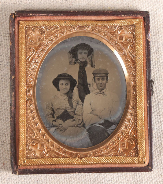 Lot 073 - Antique 1/6th Plate Ambrotype Photograph, Portrait Of Three Young People In Hats, Including Smiling Man, In Half Leatherette Case