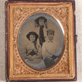 Lot 073 - Antique 1/6th Plate Ambrotype Photograph, Portrait Of Three Young People In Hats, Including Smiling Man, In Half Leatherette Case