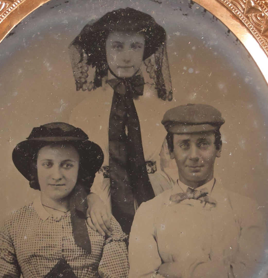 Lot 073 - Antique 1/6th Plate Ambrotype Photograph, Portrait Of Three Young People In Hats, Including Smiling Man, In Half Leatherette Case