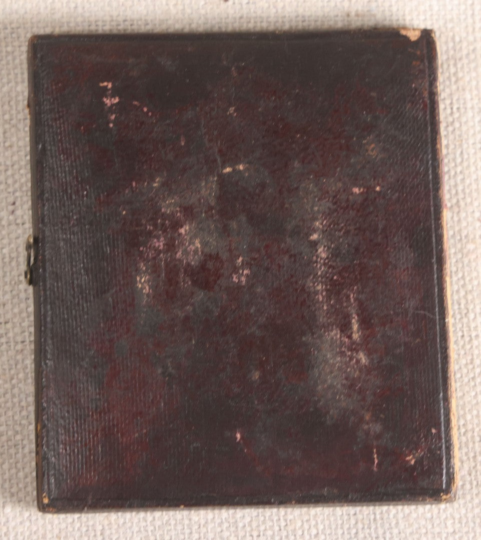 Lot 073 - Antique 1/6th Plate Ambrotype Photograph, Portrait Of Three Young People In Hats, Including Smiling Man, In Half Leatherette Case