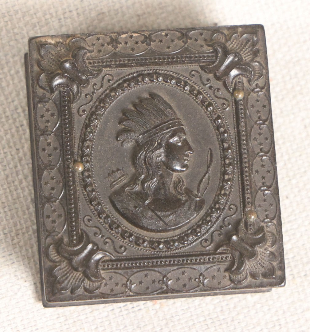 Lot 076 - Antique Thermoplastic Union Case With Native American Profile Bust And Star Border Design, Containing A 1/6th Plate Ambrotype Photograph Of A Young Man, Holmes, Booth & Haydens Label
