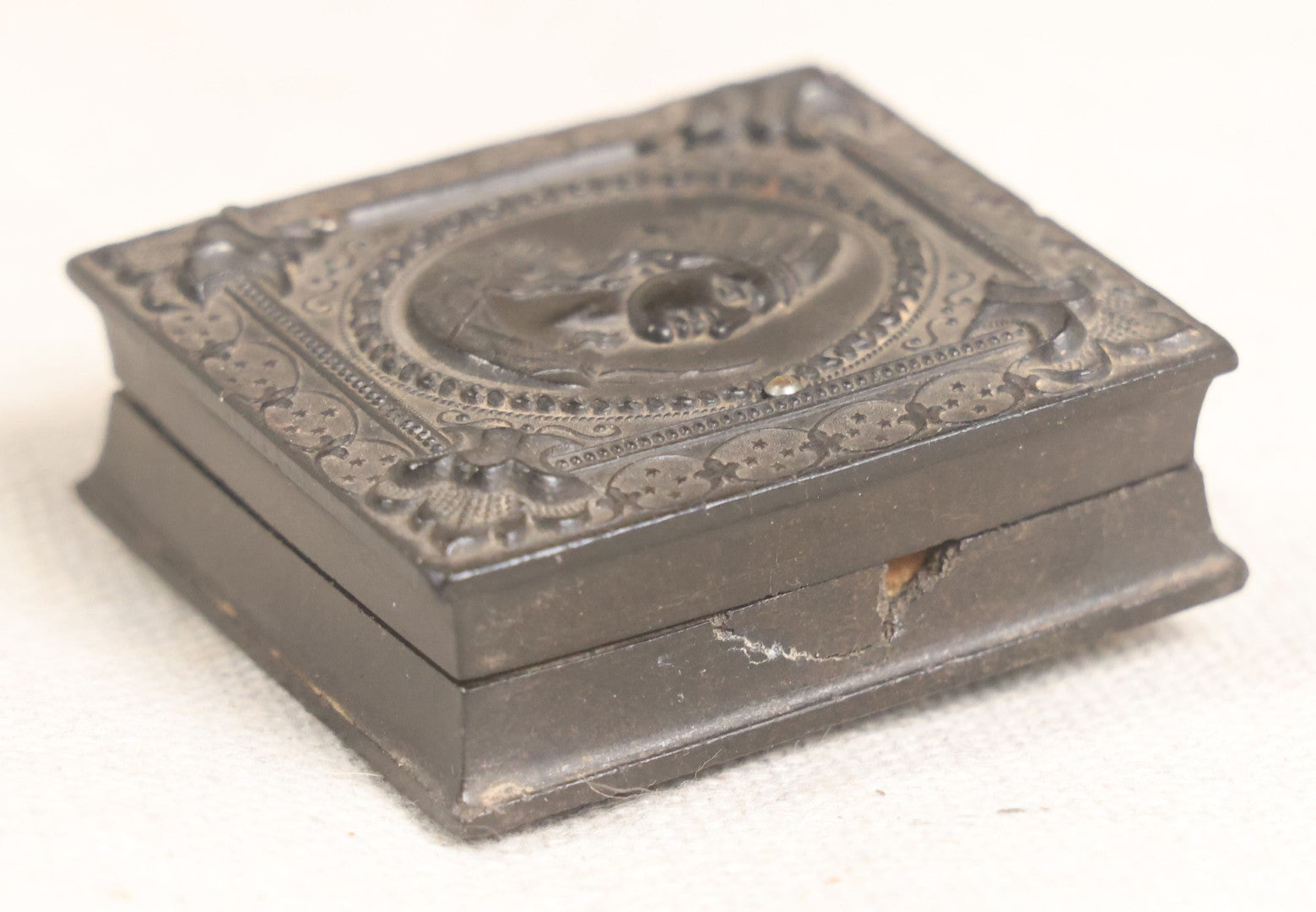 Lot 076 - Antique Thermoplastic Union Case With Native American Profile Bust And Star Border Design, Containing A 1/6th Plate Ambrotype Photograph Of A Young Man, Holmes, Booth & Haydens Label
