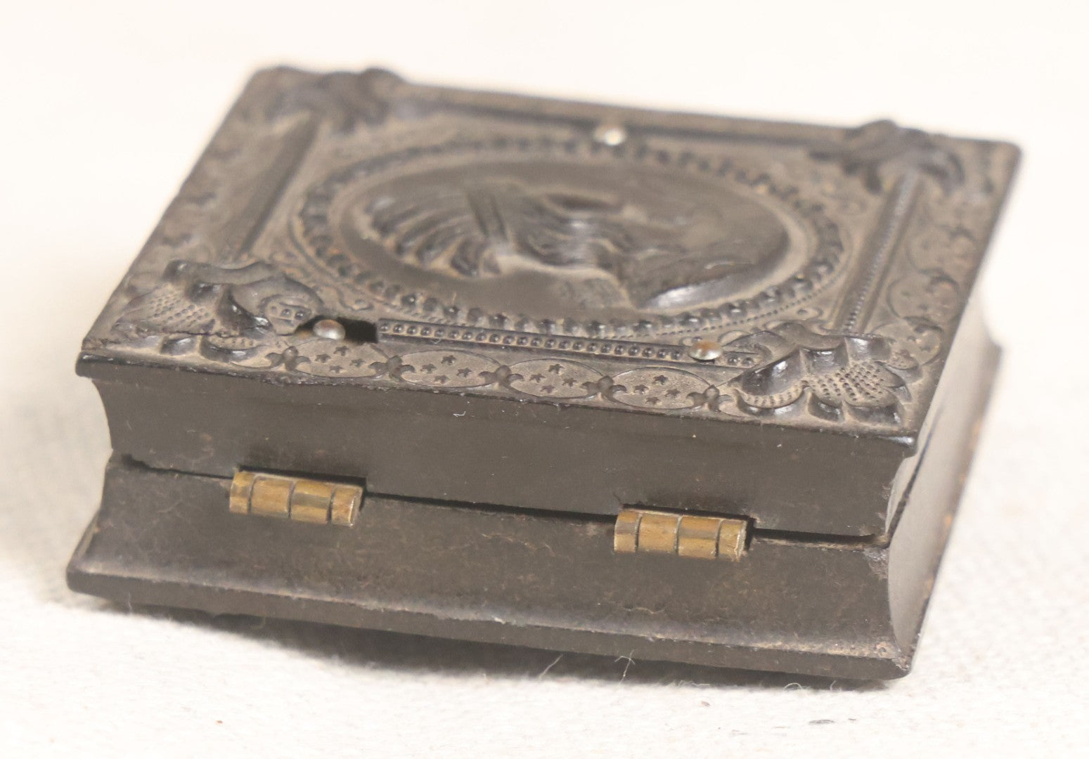 Lot 076 - Antique Thermoplastic Union Case With Native American Profile Bust And Star Border Design, Containing A 1/6th Plate Ambrotype Photograph Of A Young Man, Holmes, Booth & Haydens Label
