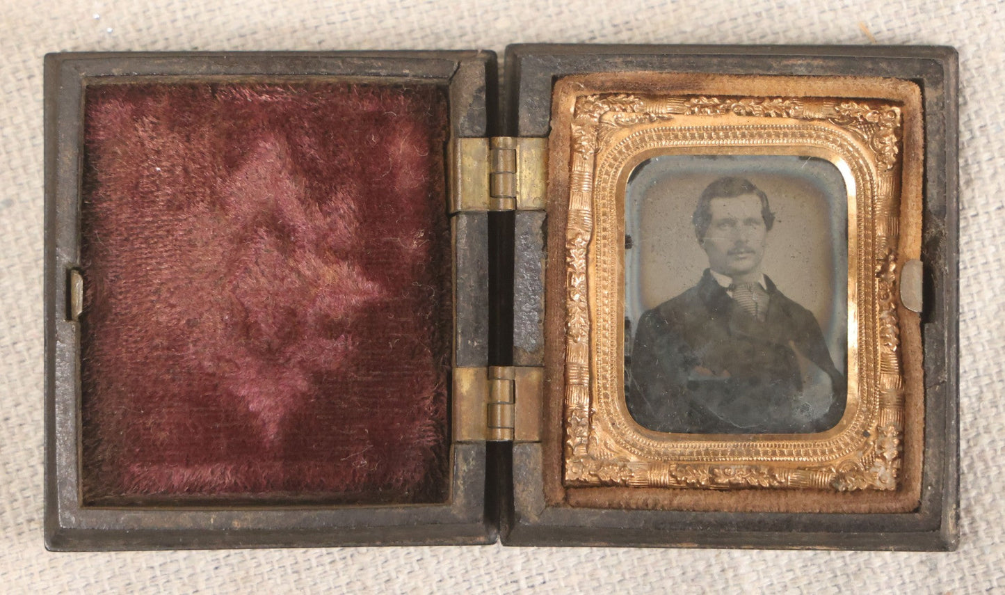 Lot 076 - Antique Thermoplastic Union Case With Native American Profile Bust And Star Border Design, Containing A 1/6th Plate Ambrotype Photograph Of A Young Man, Holmes, Booth & Haydens Label