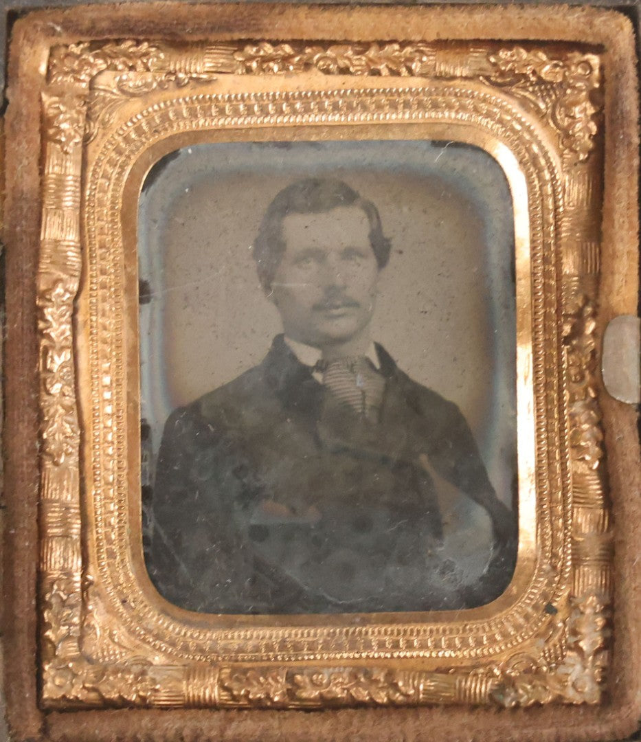 Lot 076 - Antique Thermoplastic Union Case With Native American Profile Bust And Star Border Design, Containing A 1/6th Plate Ambrotype Photograph Of A Young Man, Holmes, Booth & Haydens Label