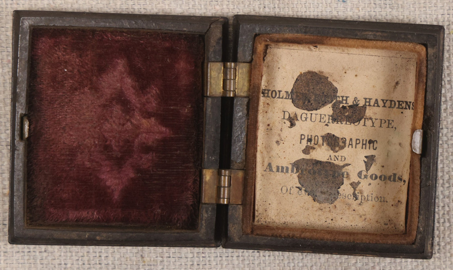 Lot 076 - Antique Thermoplastic Union Case With Native American Profile Bust And Star Border Design, Containing A 1/6th Plate Ambrotype Photograph Of A Young Man, Holmes, Booth & Haydens Label