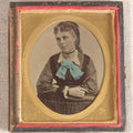 Lot 077 - Antique 1/6th Plate Tintype Photograph, Portrait Of A Young Woman With Hand-Tinted Blue Bow And Ringlet Curls, In Half Leatherette Case