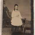 Lot 080 - Antique Tintype Photograph, Full-Length Portrait Of A Young Woman Who Appears To Be Pregnant In White Apron With Hand-Tinted Pink Bow