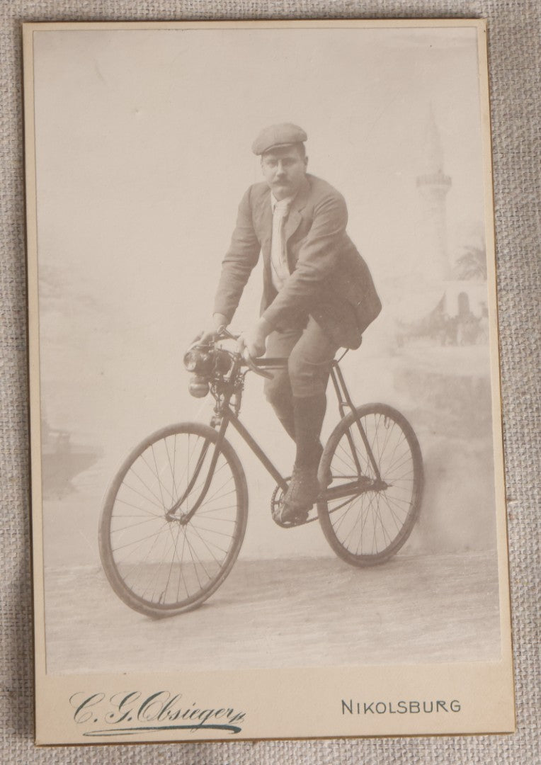 Lot 087 - Antique Cabinet Card Photograph Of A Man On A Bicycle, Photographed By C. G. Obsieger, Nikolsburg