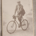 Lot 087 - Antique Cabinet Card Photograph Of A Man On A Bicycle, Photographed By C. G. Obsieger, Nikolsburg