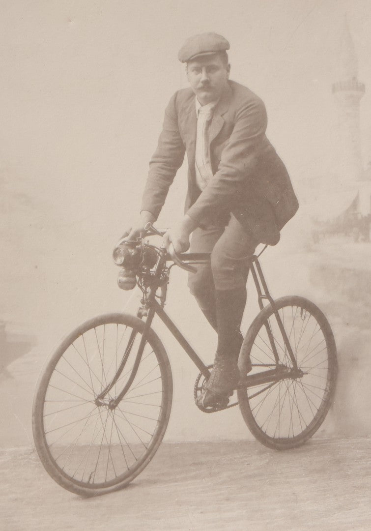 Lot 087 - Antique Cabinet Card Photograph Of A Man On A Bicycle, Photographed By C. G. Obsieger, Nikolsburg