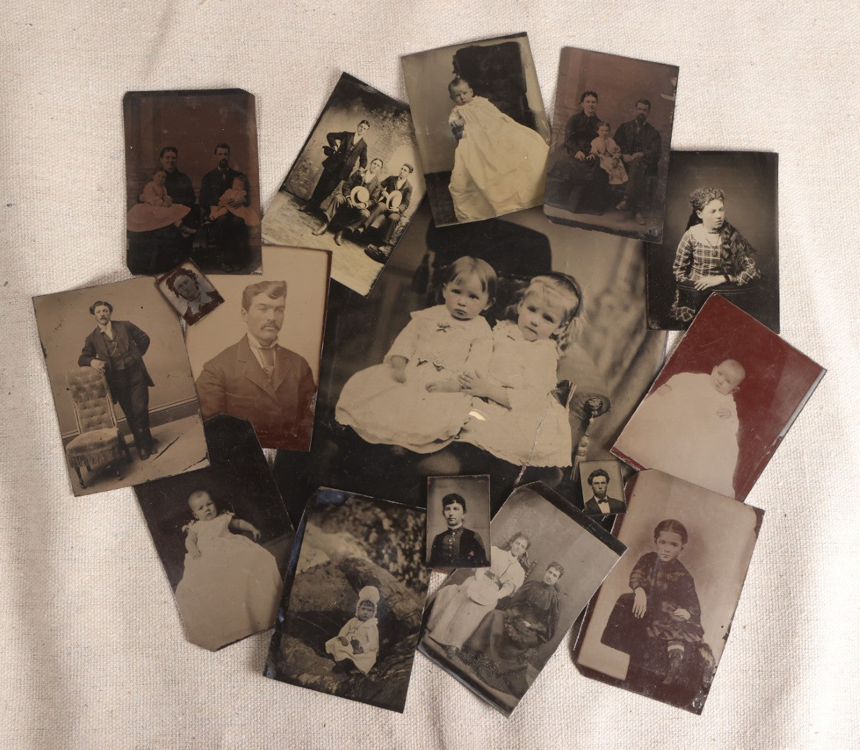 Lot 090 - Grouping Of 16 Antique Tintype Photographs Including A Full Plate Of Two Toddlers, Portraits Of Men, Women, Children, And Families