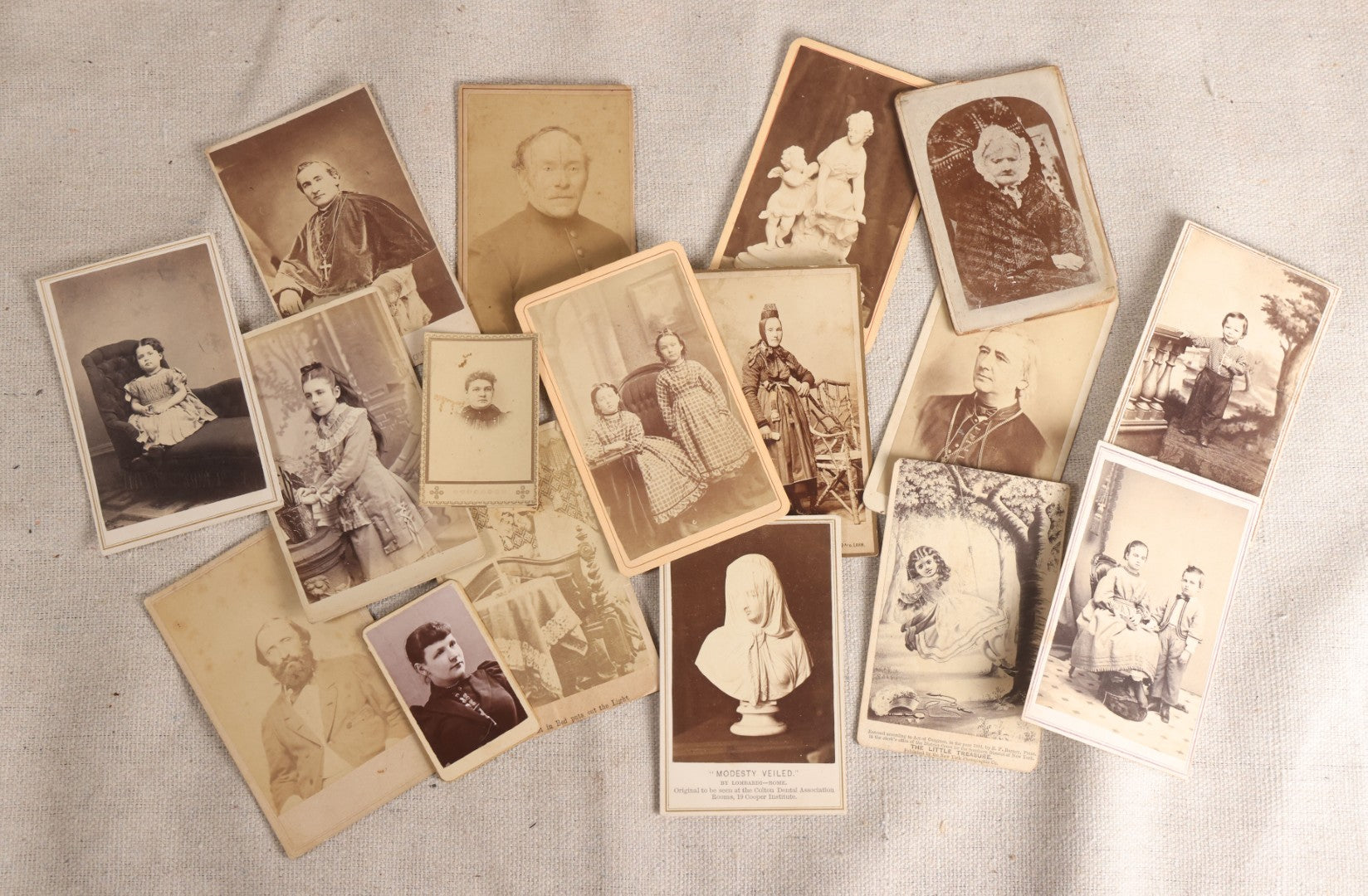 Lot 091 - Grouping Of 17 Antique Carte De Visite C.D.V.. Photographs Including Rt. Rev. P. T. O'Reilly, "Modesty Veiled" By Lombardi, Clergy, And Folk Dress