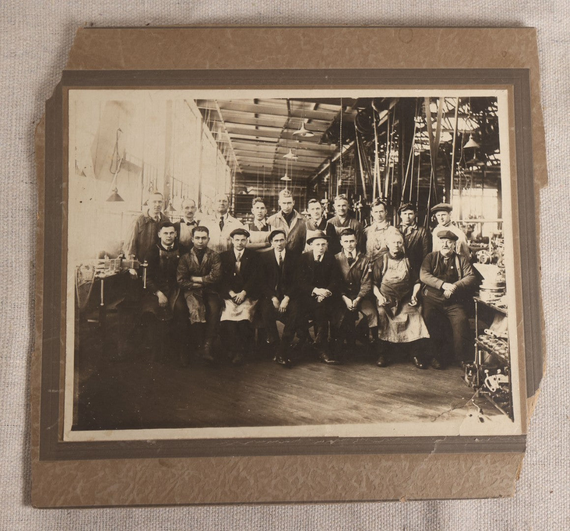 Lot 094 - Antique Board-Mounted Occupational Photograph Of Factory Workers In An Industrial Workshop