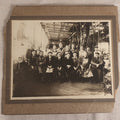 Lot 094 - Antique Board-Mounted Occupational Photograph Of Factory Workers In An Industrial Workshop