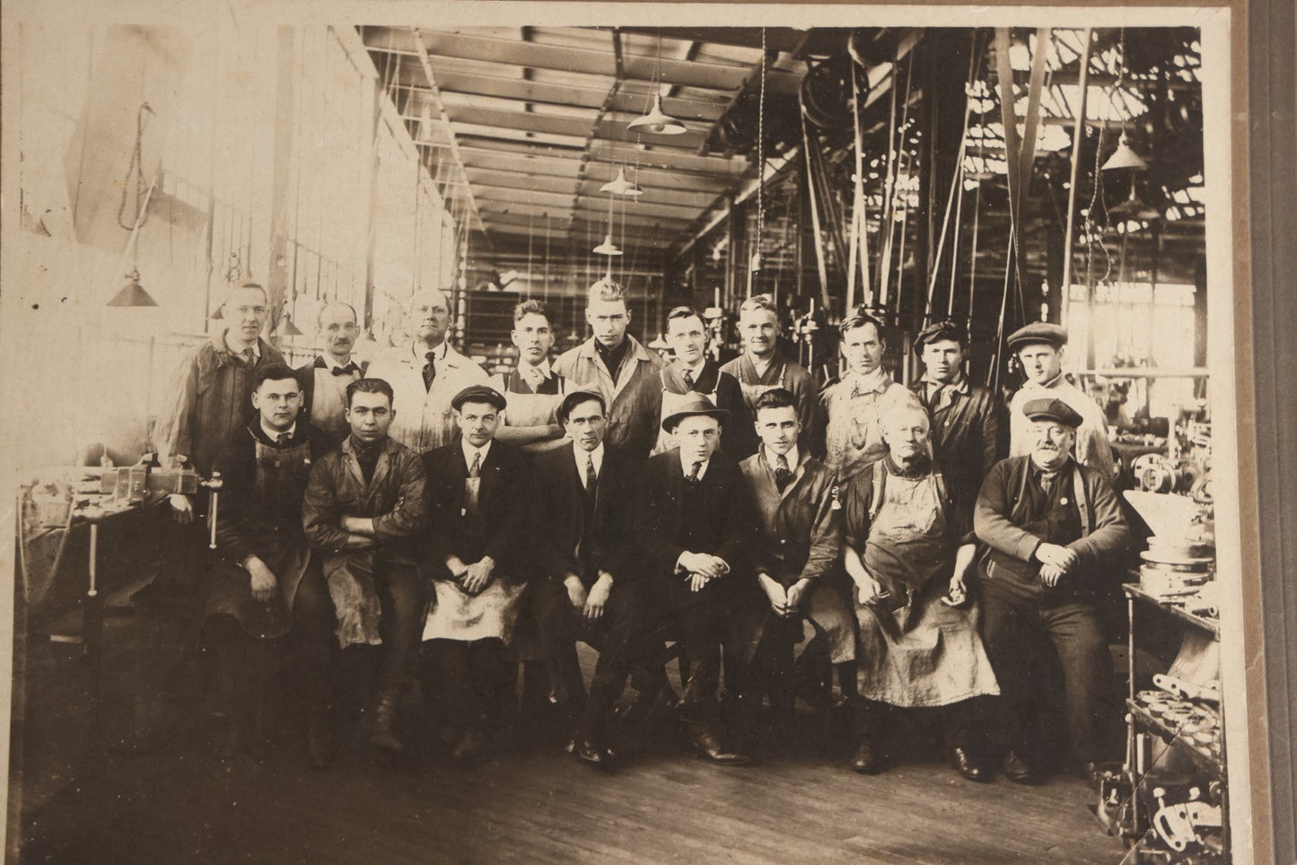 Lot 094 - Antique Board-Mounted Occupational Photograph Of Factory Workers In An Industrial Workshop