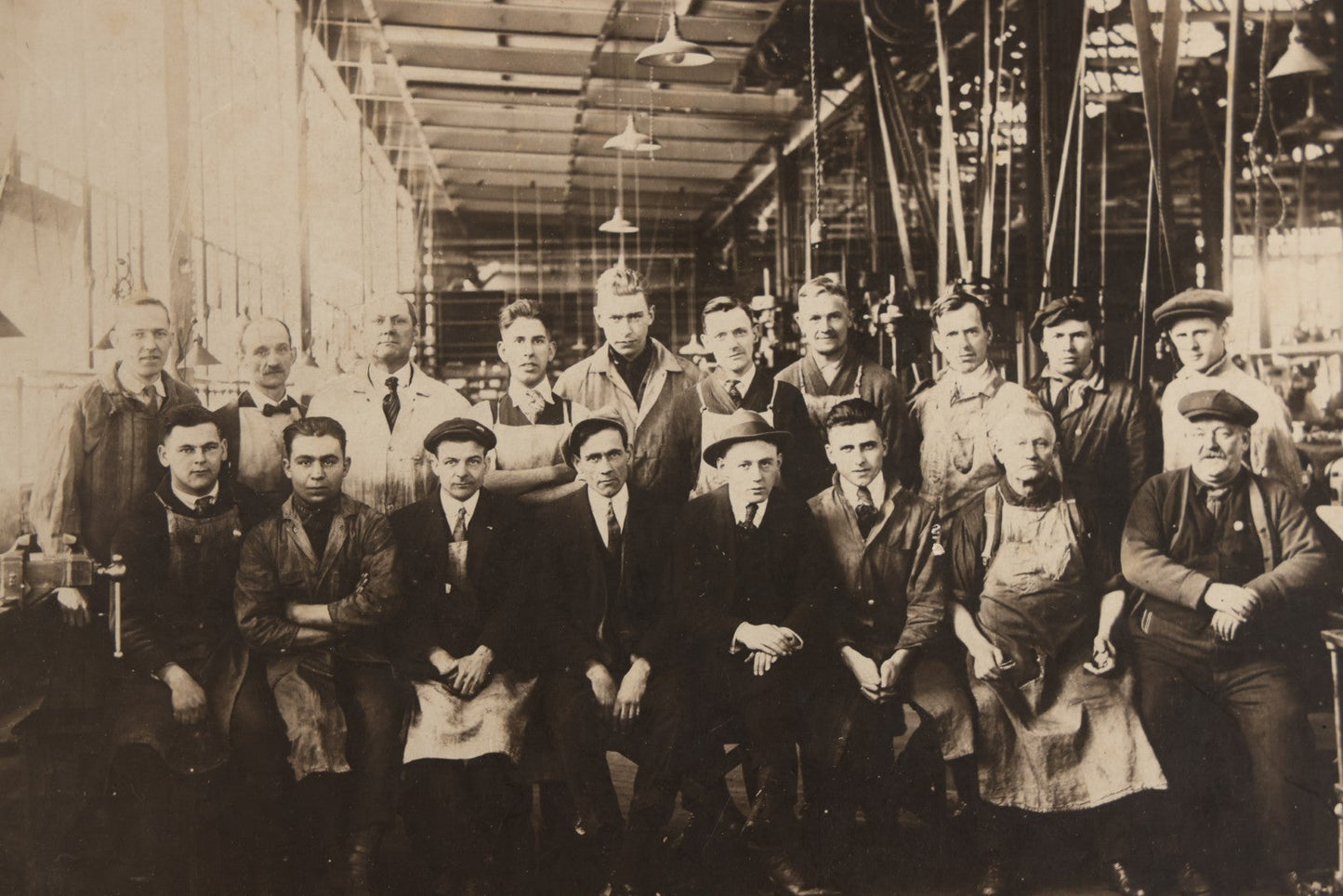Lot 094 - Antique Board-Mounted Occupational Photograph Of Factory Workers In An Industrial Workshop