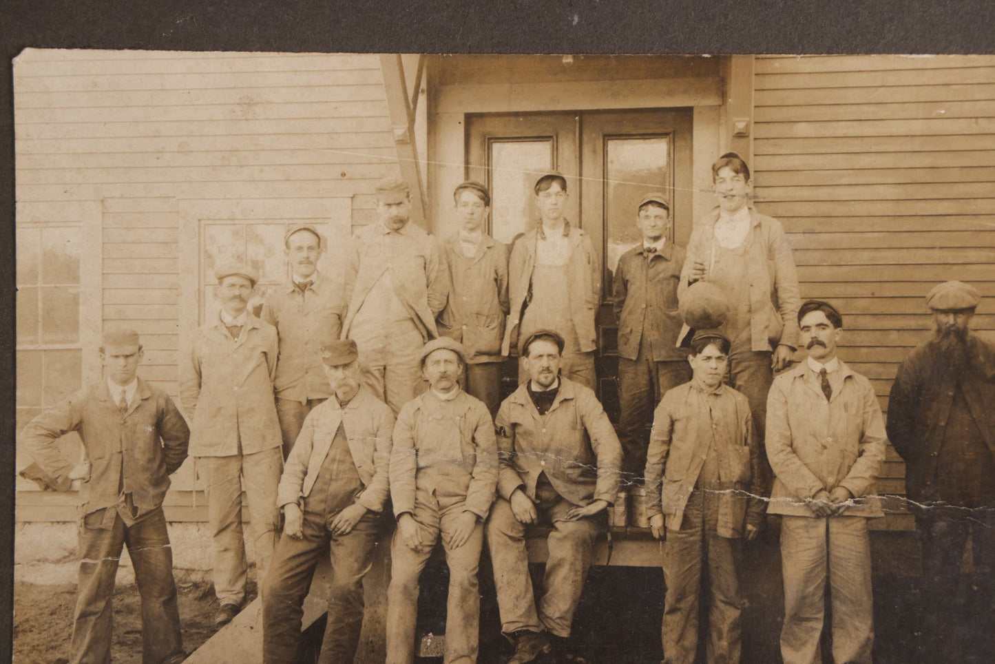 Lot 095 - Antique Board-Mounted Occupational Photograph Of A Group Of Workers Outside A Clapboard Building