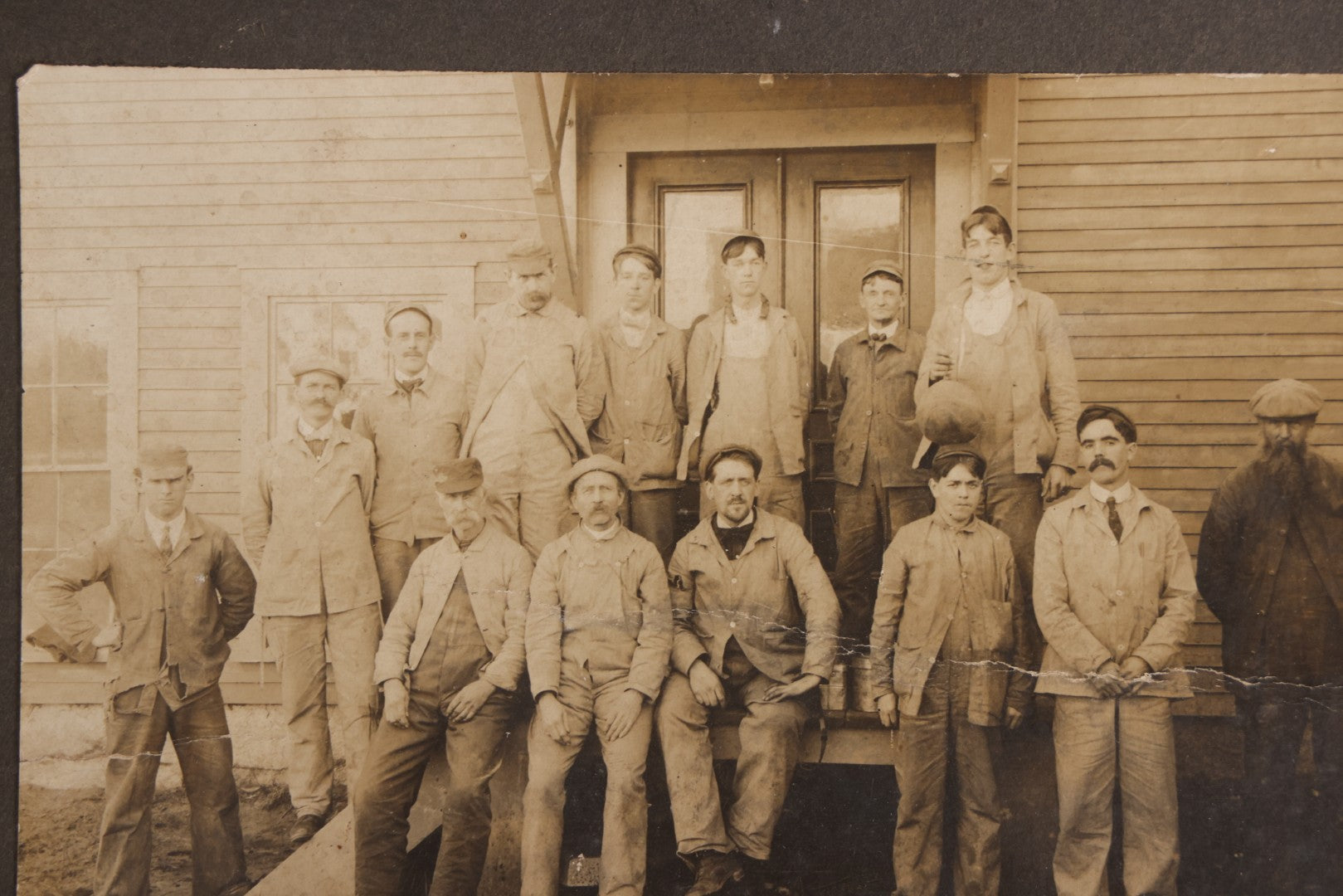 Lot 095 - Antique Board-Mounted Occupational Photograph Of A Group Of Workers Outside A Clapboard Building