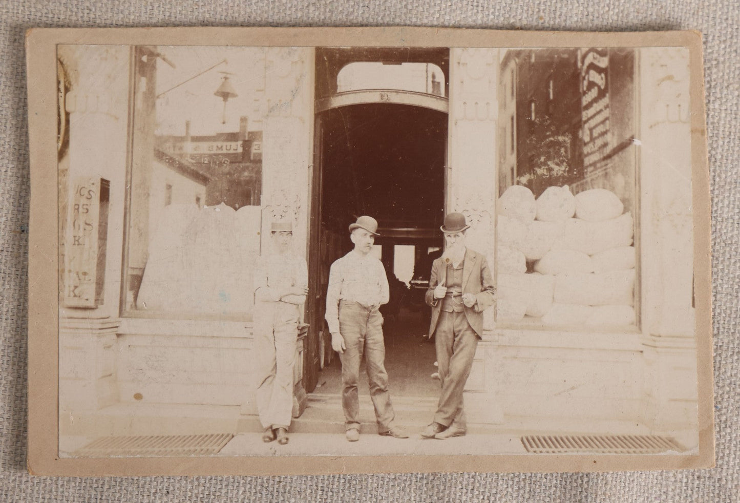 Lot 097 - Antique Cabinet Card Occupational Photograph Of Three Men Standing In A Commercial Storefront Doorway