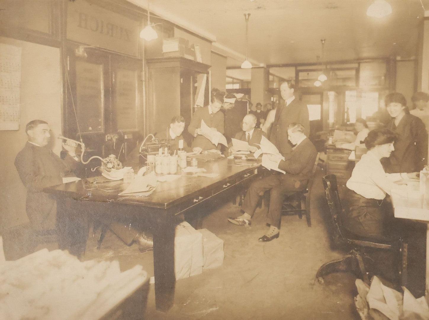 Lot 100 - Antique Board-Mounted Occupational Photograph Of An Office Interior With Wax Cylinder Dictating Machines, Zurich Insurance Sign On Door