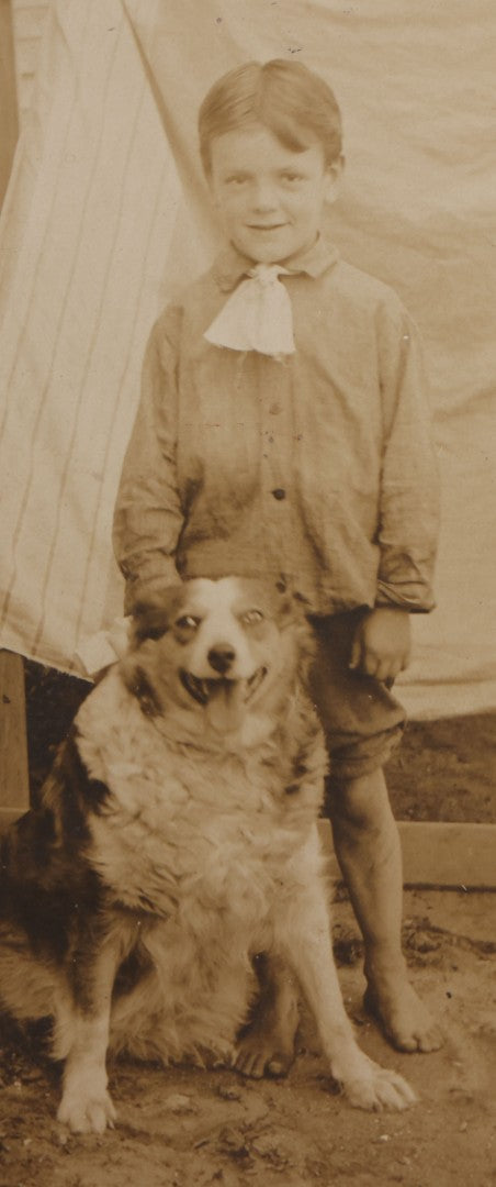 Lot 103 - Antique Board-Mounted Photograph Of A Barefoot Boy With A Dog
