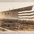 Lot 109 - Antique Board-Mounted Photograph Of World War I Soldiers In Formation Before A Large American Flag, Photographed By Kinsey Photo, Seattle