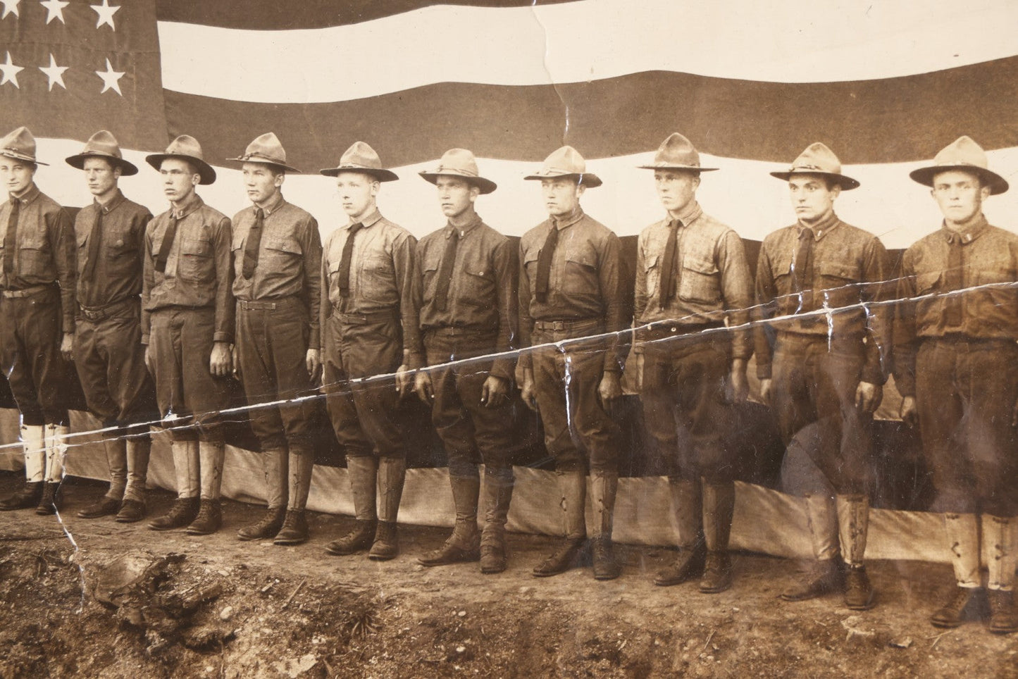 Lot 109 - Antique Board-Mounted Photograph Of World War I Soldiers In Formation Before A Large American Flag, Photographed By Kinsey Photo, Seattle