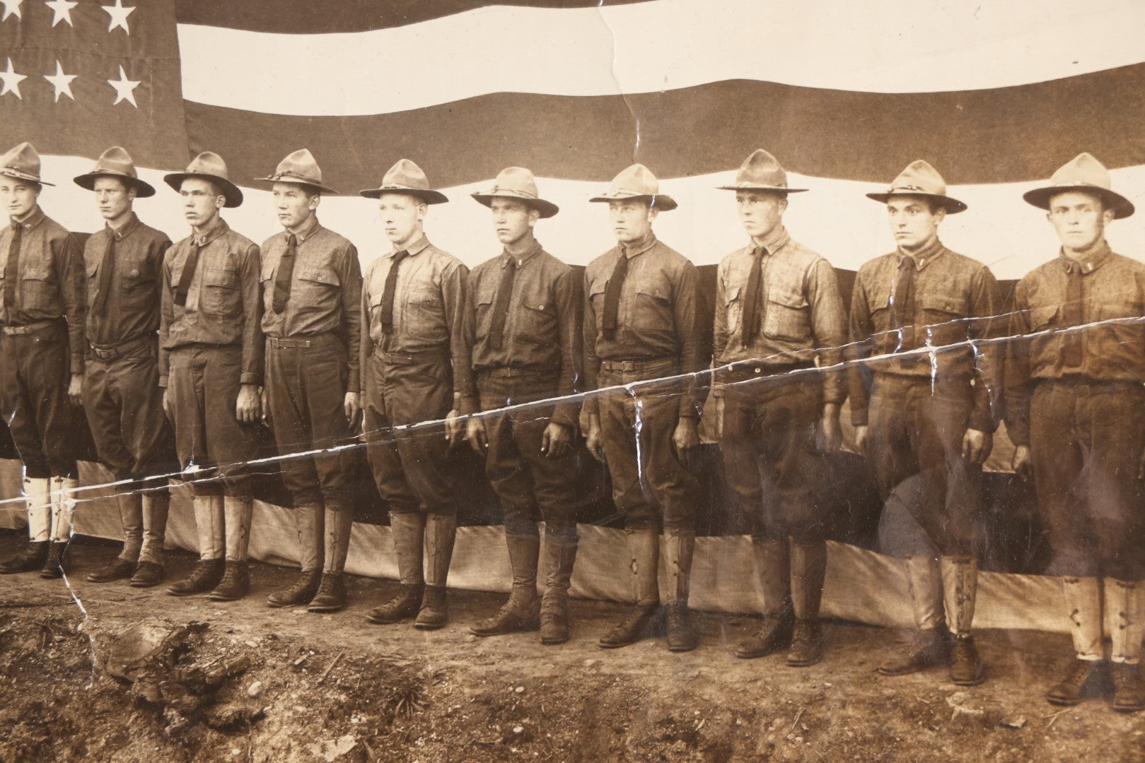 Lot 109 - Antique Board-Mounted Photograph Of World War I Soldiers In Formation Before A Large American Flag, Photographed By Kinsey Photo, Seattle