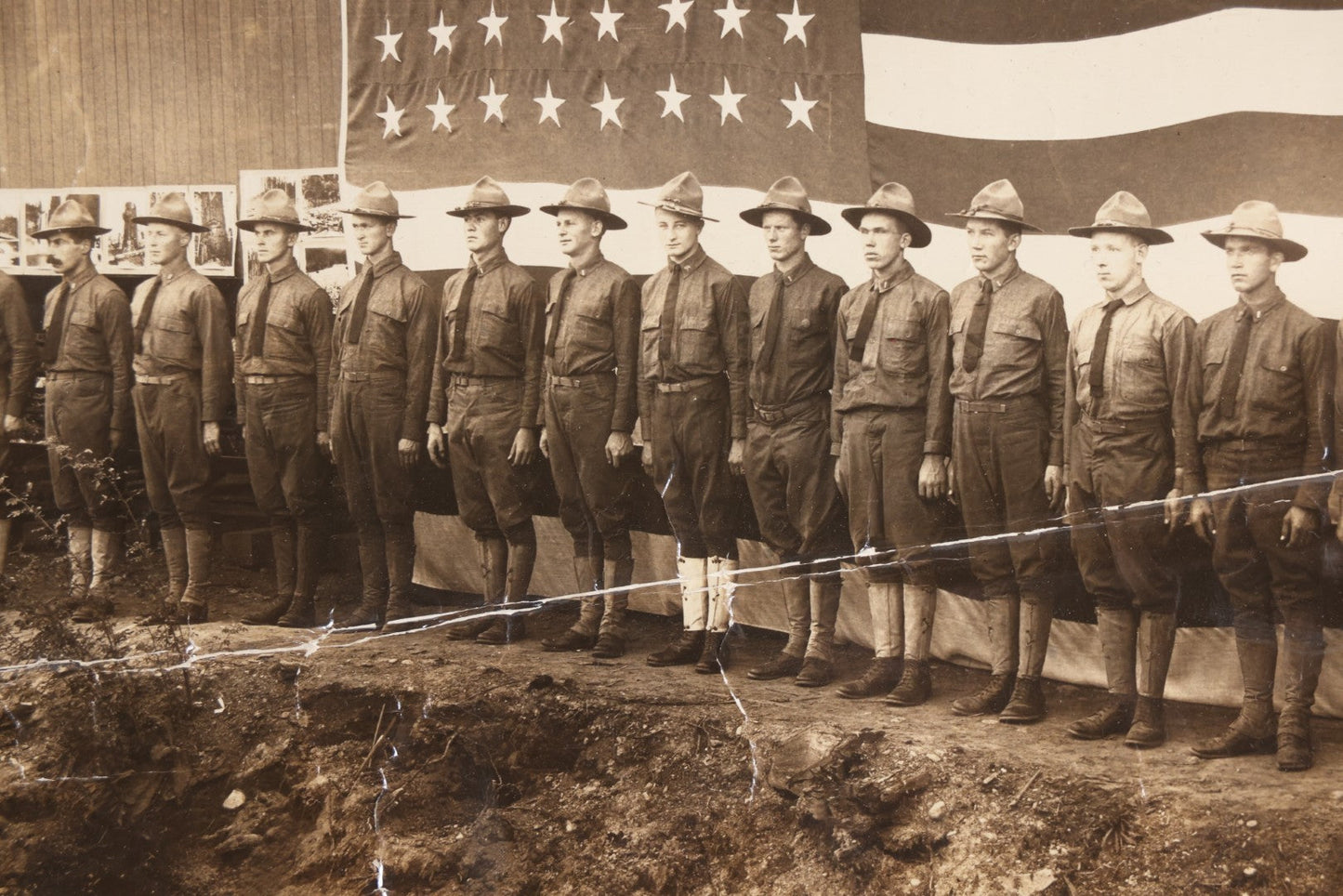 Lot 109 - Antique Board-Mounted Photograph Of World War I Soldiers In Formation Before A Large American Flag, Photographed By Kinsey Photo, Seattle