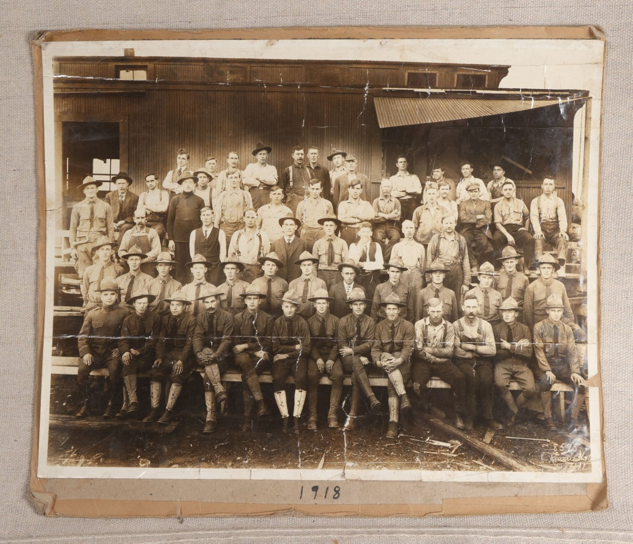 Lot 110 - Antique Board-Mounted 1918 Photograph Of World War I Soldiers And Workers, Photographed By Kinsey Photo, Seattle