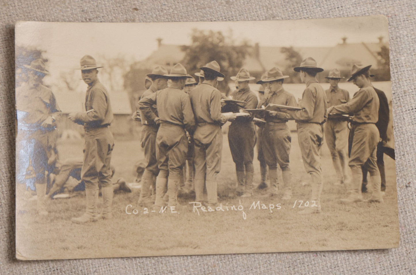 Lot 111 - Grouping Of 25 World War I Era Postcards, Mostly R.P.P.C.., From George F.A. Mulcahy, Including Training Scenes At Plattsburgh And Camp Devens, Barracks Interior, Rifle Training, Map Reading, And Marching
