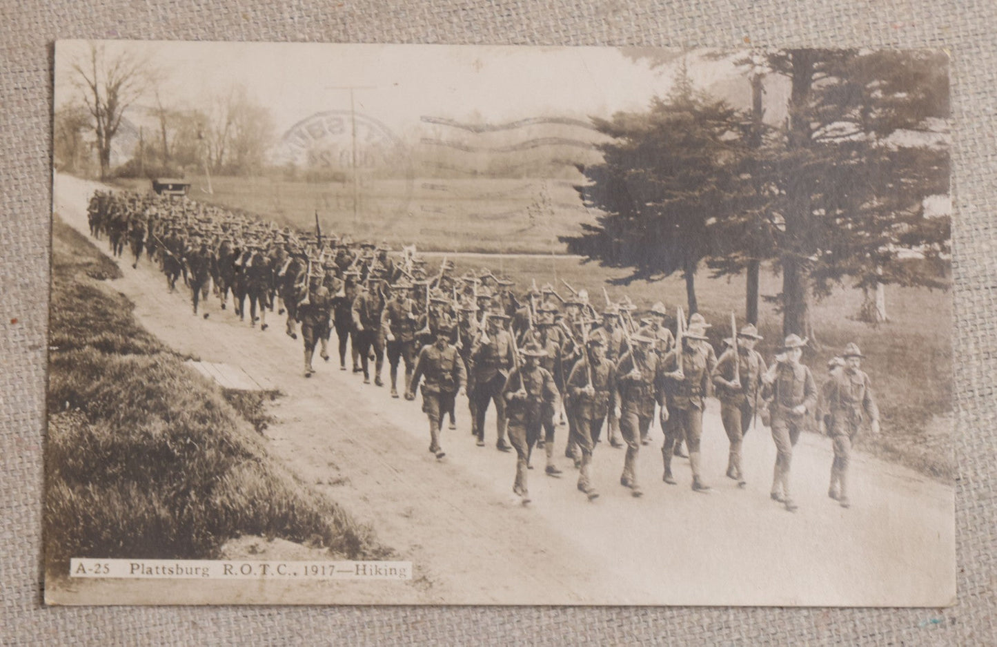 Lot 111 - Grouping Of 25 World War I Era Postcards, Mostly R.P.P.C.., From George F.A. Mulcahy, Including Training Scenes At Plattsburgh And Camp Devens, Barracks Interior, Rifle Training, Map Reading, And Marching
