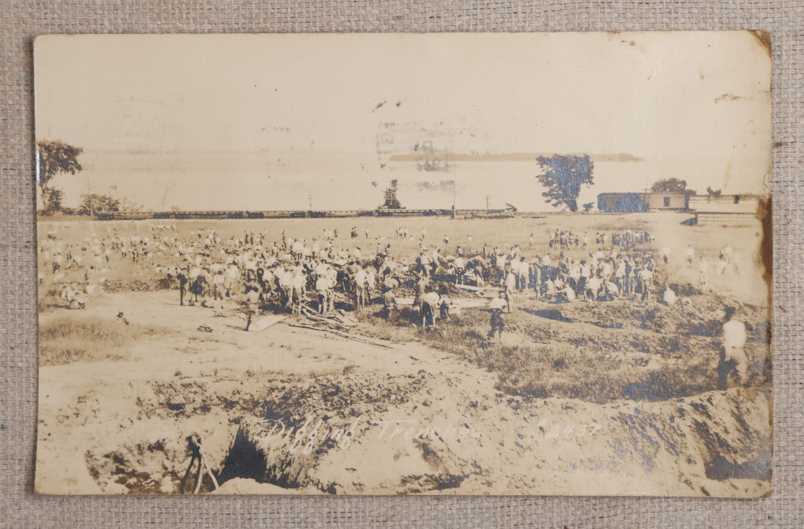 Lot 111 - Grouping Of 25 World War I Era Postcards, Mostly R.P.P.C.., From George F.A. Mulcahy, Including Training Scenes At Plattsburgh And Camp Devens, Barracks Interior, Rifle Training, Map Reading, And Marching