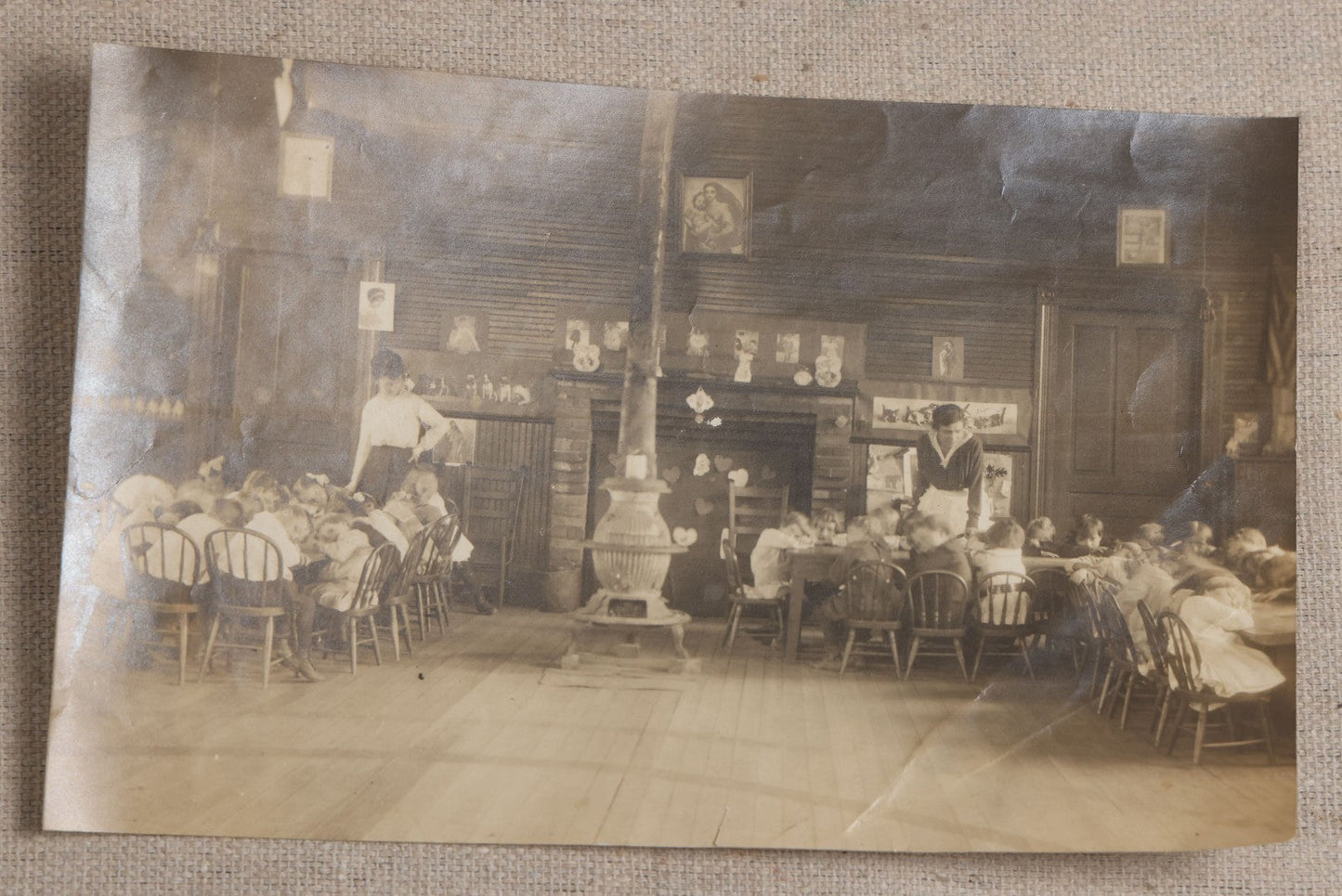 Lot 114 - Antique Unmounted Photograph Of A Schoolroom Interior With Young Children, Pot-Belly Stove, And Fireplace