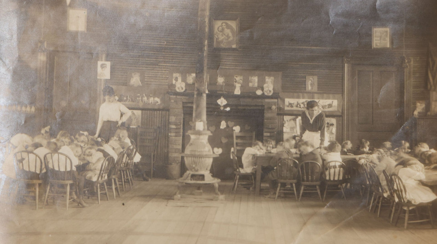 Lot 114 - Antique Unmounted Photograph Of A Schoolroom Interior With Young Children, Pot-Belly Stove, And Fireplace