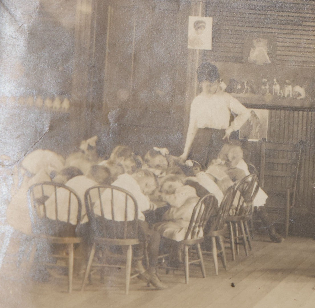 Lot 114 - Antique Unmounted Photograph Of A Schoolroom Interior With Young Children, Pot-Belly Stove, And Fireplace