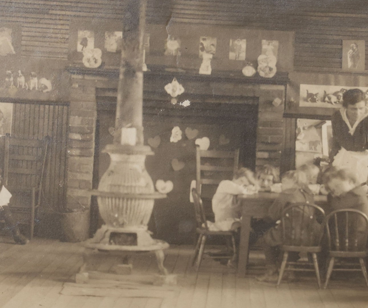 Lot 114 - Antique Unmounted Photograph Of A Schoolroom Interior With Young Children, Pot-Belly Stove, And Fireplace
