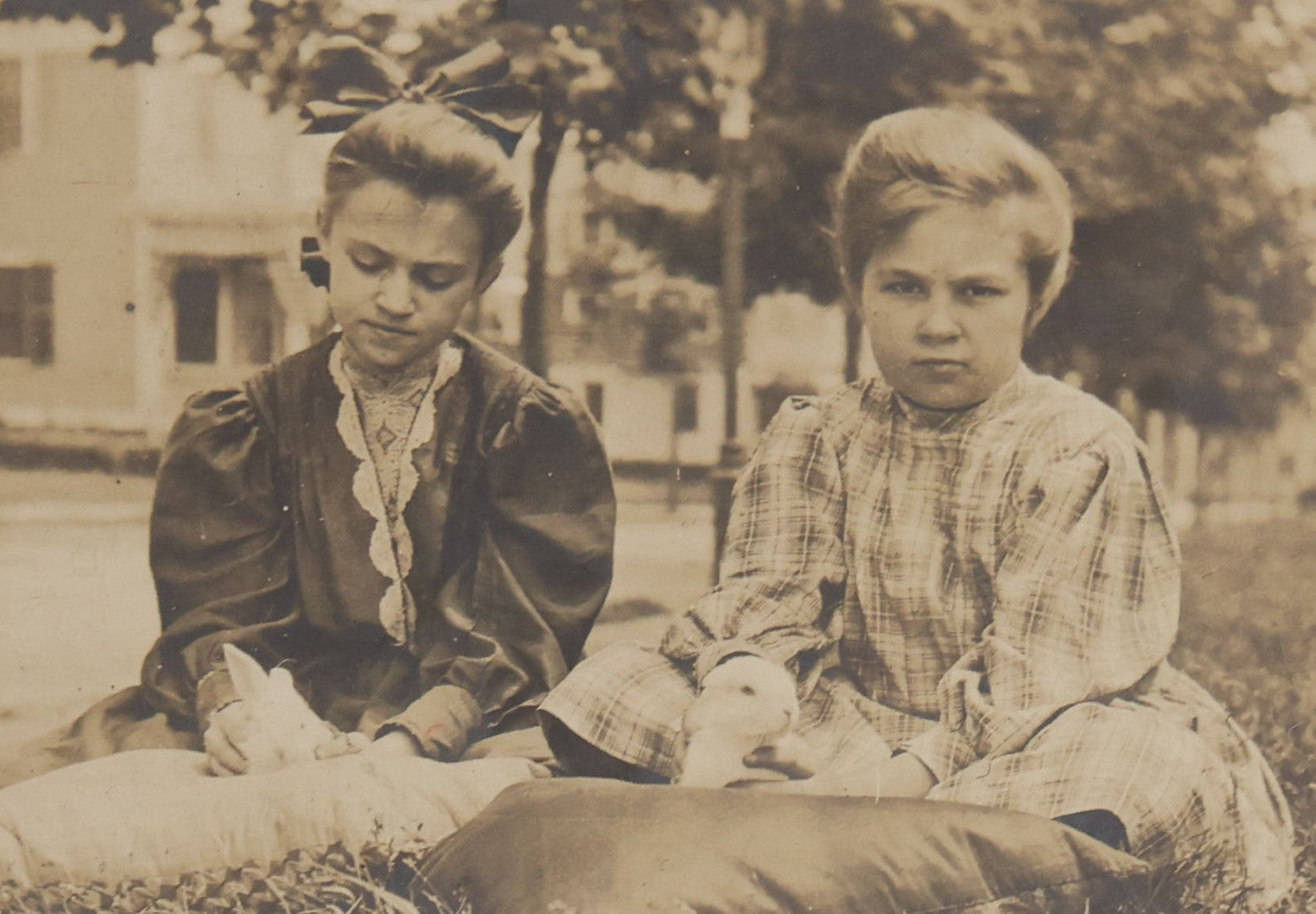 Lot 115 - Grouping Of Six Antique Board-Mounted Photographs Of Children, Including American Flag, Pet Bunnies, Pet Chickens, Doll In Pram, And Winter Sled Scene