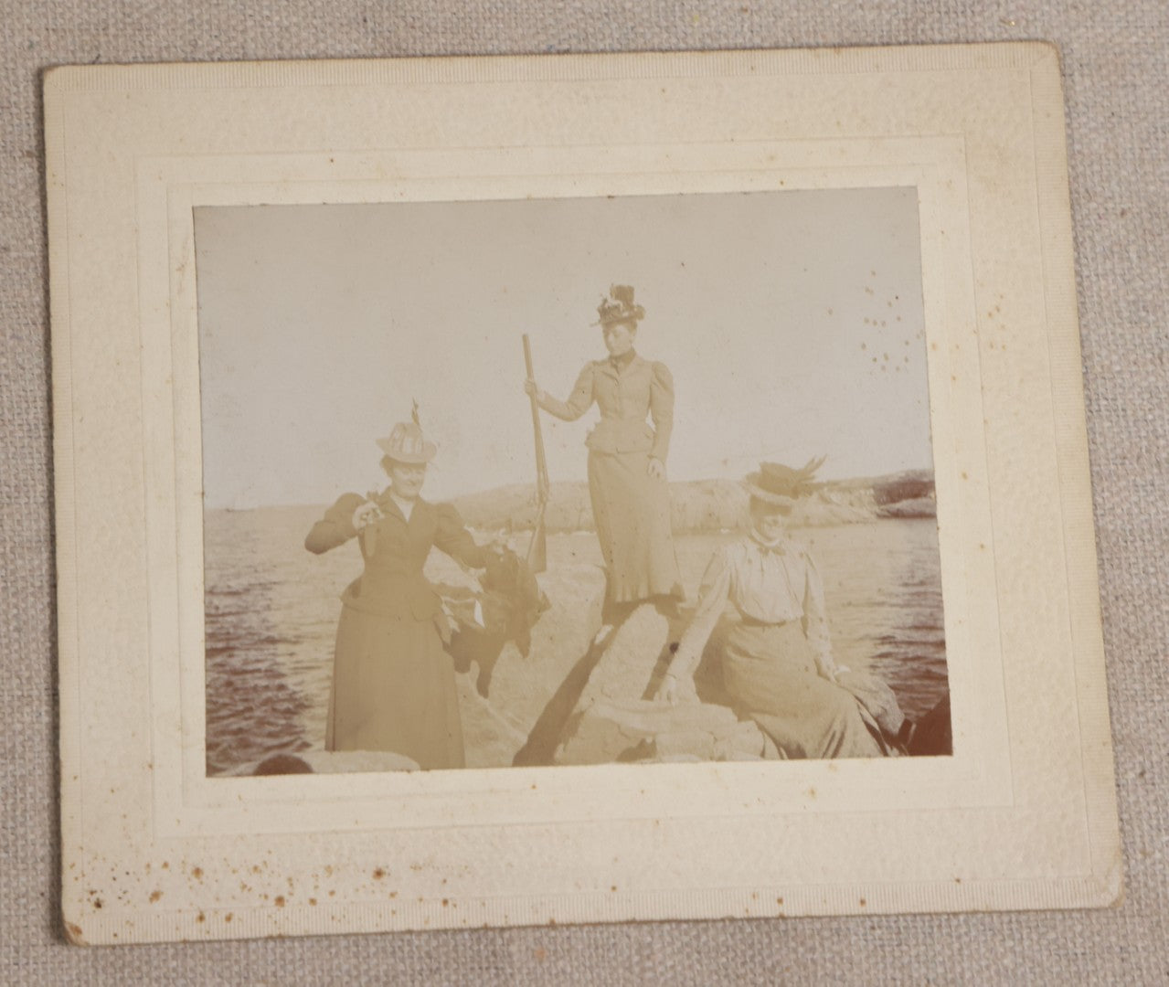Lot 116 - Grouping Of Five Antique Board-Mounted Photographs, Including Bird Hunting With Shotguns, Woman With Lute, Uniformed Man With Horn Lapel Pin, And Dog On A Stoop