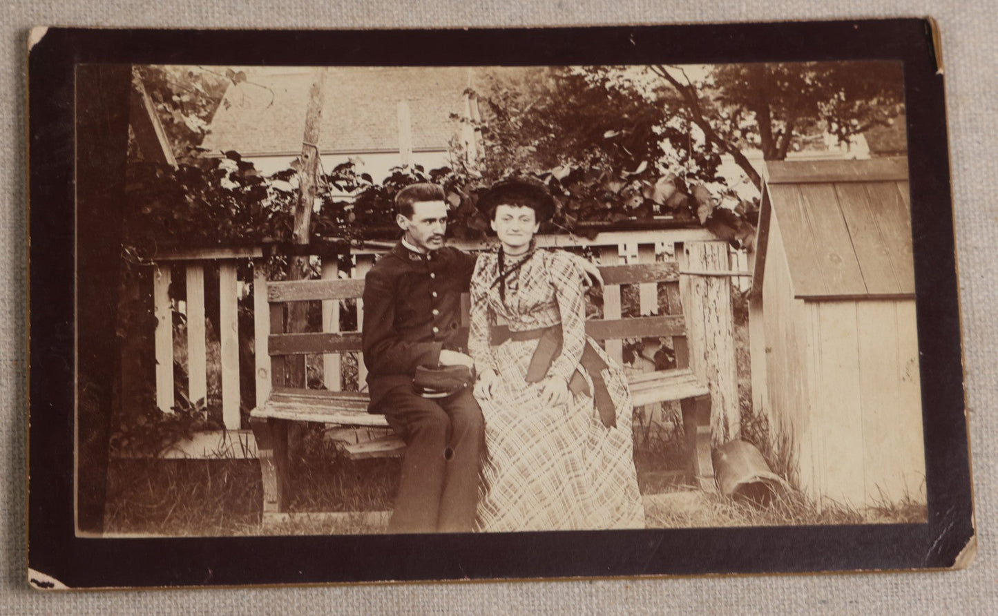 Lot 116 - Grouping Of Five Antique Board-Mounted Photographs, Including Bird Hunting With Shotguns, Woman With Lute, Uniformed Man With Horn Lapel Pin, And Dog On A Stoop