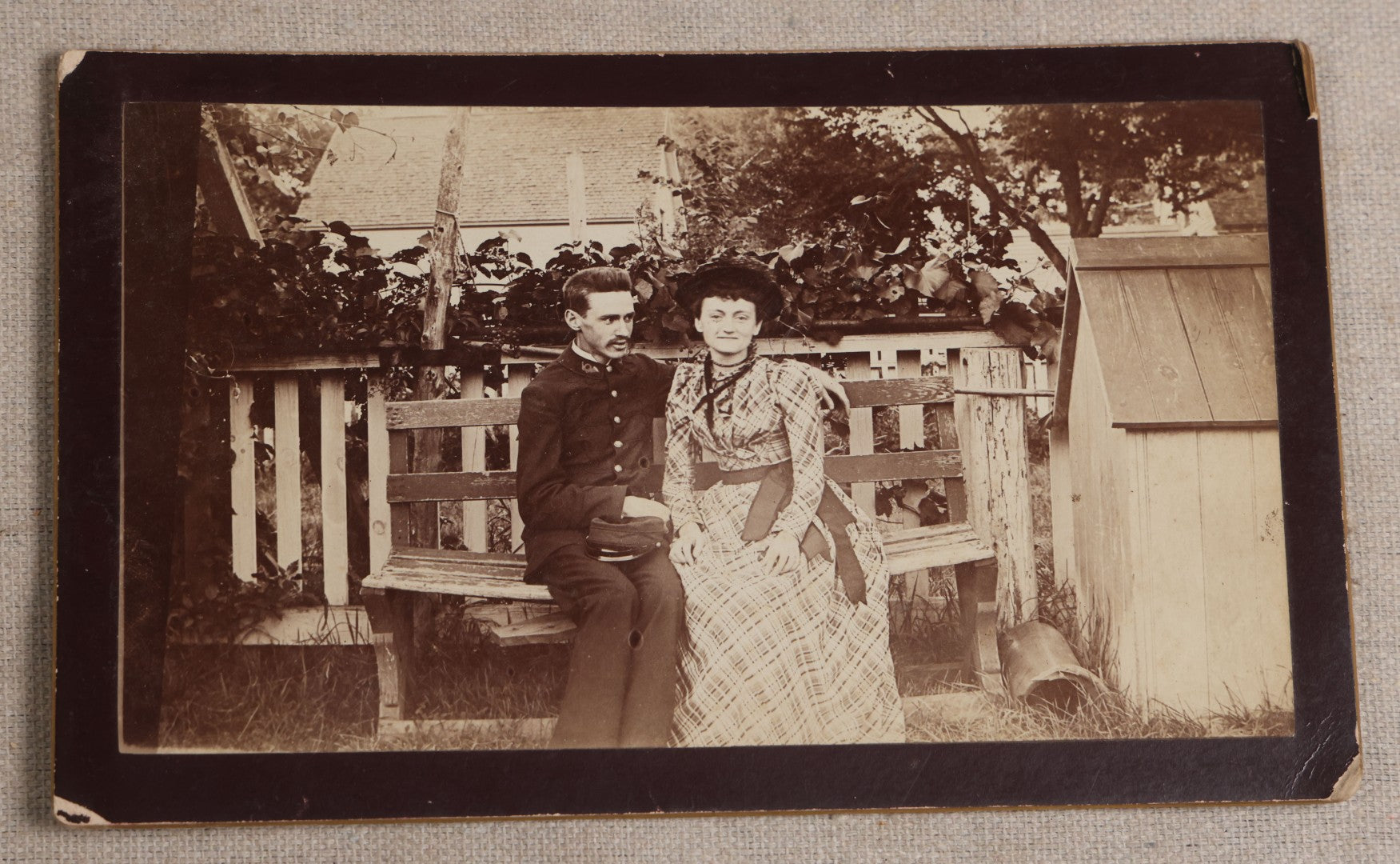 Lot 116 - Grouping Of Five Antique Board-Mounted Photographs, Including Bird Hunting With Shotguns, Woman With Lute, Uniformed Man With Horn Lapel Pin, And Dog On A Stoop