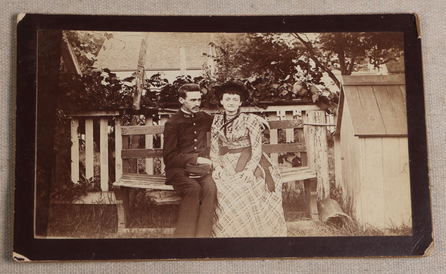 Lot 116 - Grouping Of Five Antique Board-Mounted Photographs, Including Bird Hunting With Shotguns, Woman With Lute, Uniformed Man With Horn Lapel Pin, And Dog On A Stoop
