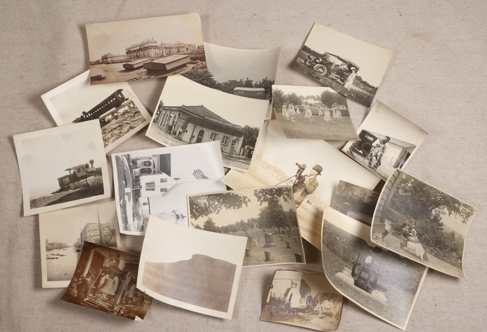 Lot 121 - Grouping Of 18 Antique And Vintage Snapshot Photographs, Including The Old Man Of The Mountain, Mount Washington Railway, Coca-Cola Billboard In A Flood, Girls Dancing In Flower Headbands, Liberty Bell, And Early Motion Picture Camera