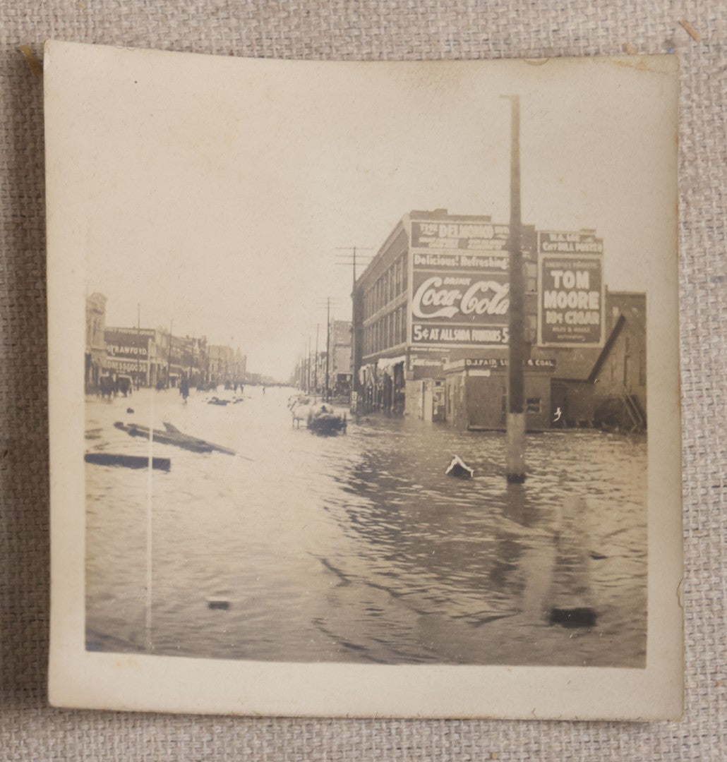 Lot 121 - Grouping Of 18 Antique And Vintage Snapshot Photographs, Including The Old Man Of The Mountain, Mount Washington Railway, Coca-Cola Billboard In A Flood, Girls Dancing In Flower Headbands, Liberty Bell, And Early Motion Picture Camera