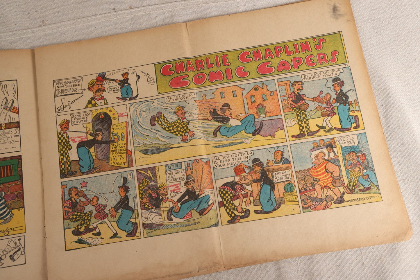 Lot 123 - "Charlie Chaplin's Funny Stunts" Antique Color Illustrated Comic Book, No. 380, Published By M. A. Donohue & Co., Chicago And New York, 1917, Note Large Fold Through Center